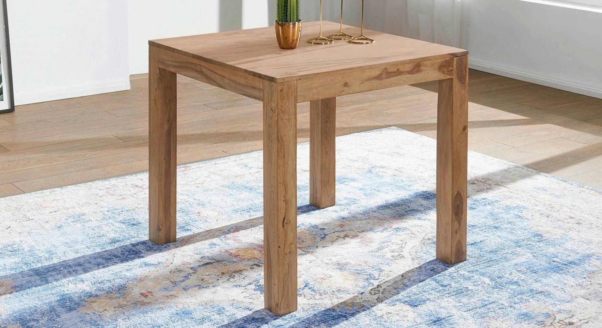 Coco Solid Wood 4 Seater Dining Table in Natural Finish Urban Ladder