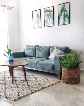 We’re loving this clean, modern sofa put together by @UrbanLadder #ULStory Also loving the Frangipani Cushion Cover.
